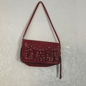 Susan Farber red clutch